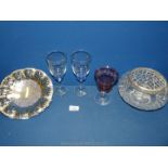 A cut glass rose bowl, cranberry wine glass and two blue stem goblets,