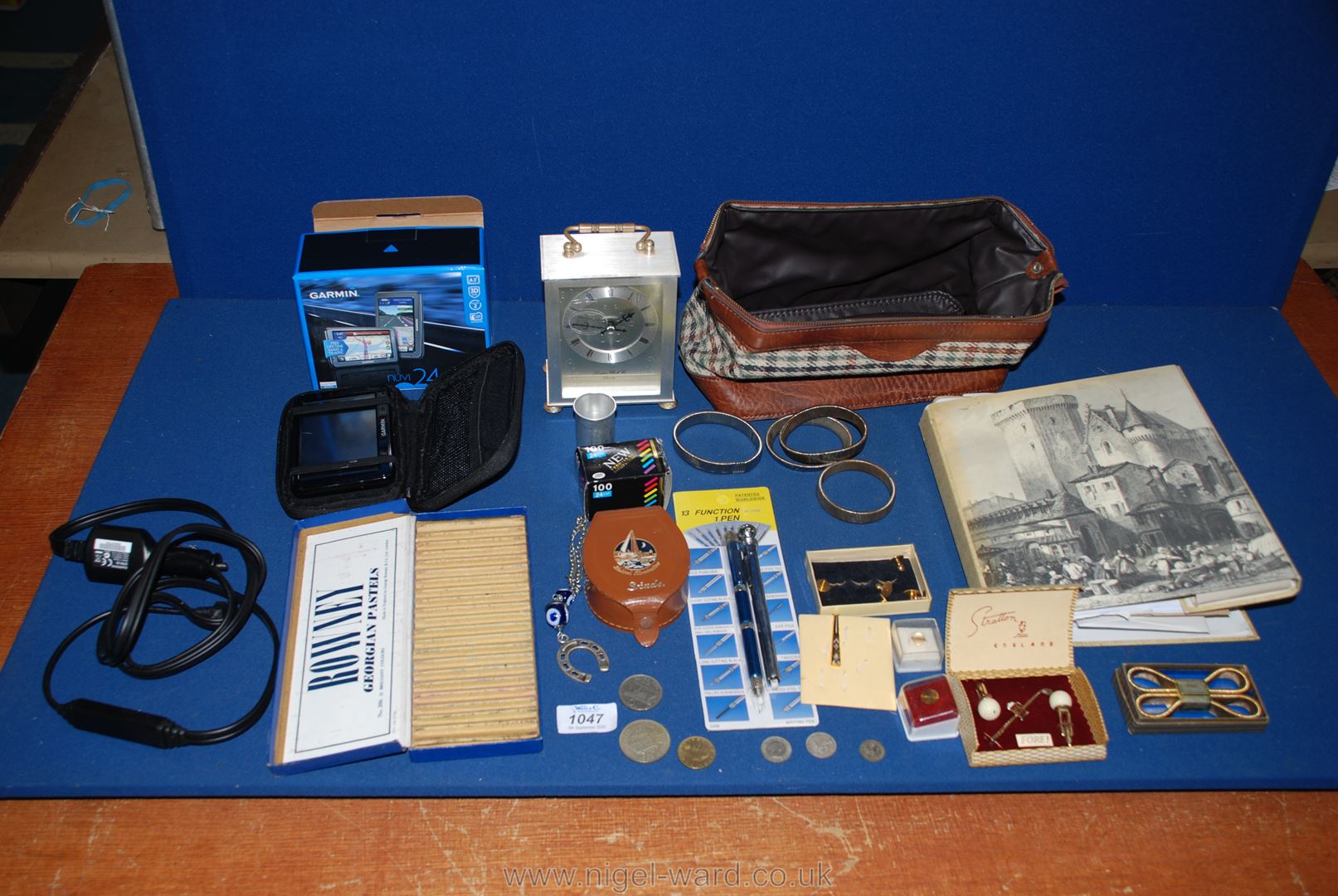 A quantity of miscellanea including a Garmin sat-nav, a gentleman's toilet bag, cuff links,