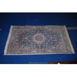 A contemporary Eastern type bordered, patterned and fringed Rug,