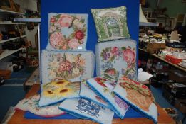 A quantity of needlepoint Cushions, some with blue velvet backing, some a/f.