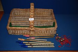 A 1930's wicker Cutlery Tray and a quantity of 1930's Penny Whistles.