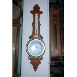 A wooden cased banjo Aneroid Barometer/thermometer.