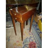 A small Mahogany games/sewing Table with two drawers and two drop leaves.