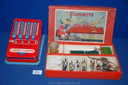 A tin-plate toy Adding machine and a 1950's 'The Favourite' race Game.