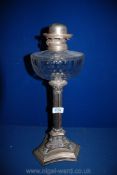 A silver plated Corinthian column oil Lamp with glass reservoir, 19'' tall,