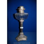 A silver plated Corinthian column oil Lamp with glass reservoir, 19'' tall,