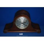 A 1920's Napoleon hat Oak cased mantle Clock with nine bar Westminster chiming movement,