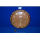 A 1960's Teak dome faced wall Clock with Swiss 18 day movement,