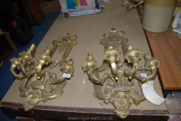 A pair of heavy ornate gilded cast metal four branch wall Lights in Louis XV style,