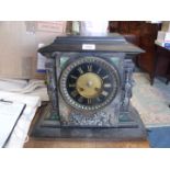 A most substantial and impressive black stone cased Bracket Clock having black chapter ring with