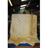 A two-tone pale yellow raw silk finish double bedspread/duvet cover and matching pillowshams,