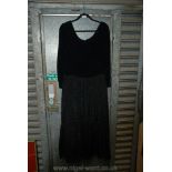 A black vintage Velvet and Taffeta long sleeved evening Dress.