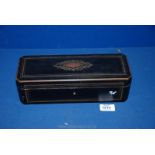 An ebonised Glove Box, 11 1/2'' long x 4'' wide x 3 1/4'' high.