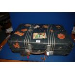 A vintage Suitcase having leather handle and travel stickers including Italy, Milan, etc.