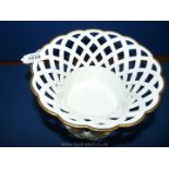 A fine quality porcelain white ground blue and gilt decorated lattice pierced Table Centrepiece