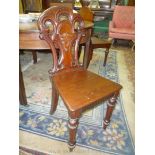 A Victorian Mahogany solid seated Hall Chair having turned front legs,