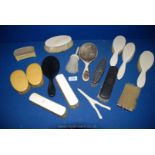 A quantity of miscellaneous dressing table items to include hand mirrors, brushes, glove stretchers,