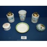 Two Limoges France cigarette Lighters, a small Limoges tumbler and two small trinket pots with lids.