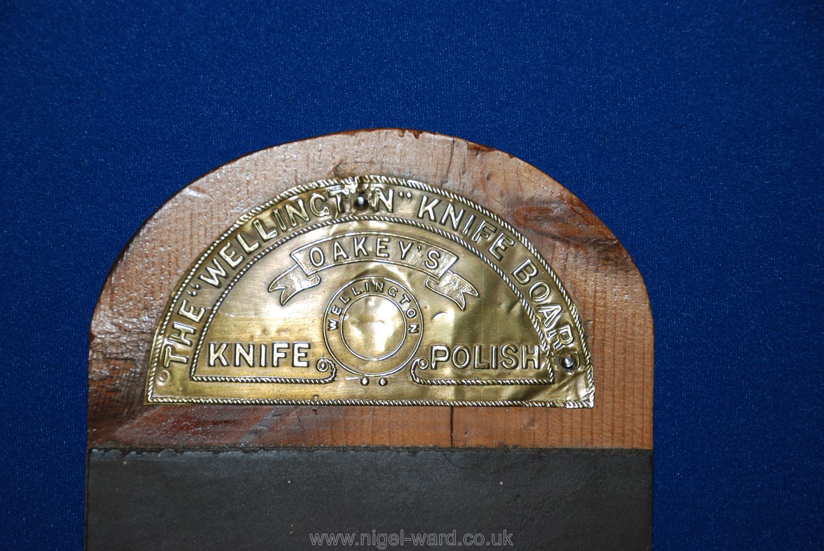 A Mahogany newel Cap and a 1930's Oakey's 'Wellington Knife' Strop. - Image 2 of 2