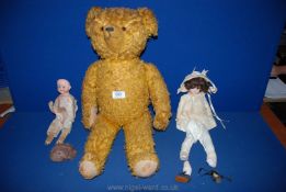 A much loved old Teddy, two Victorian dolls with porcelain heads, one marked made in Germany, a/f.