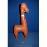 A large stylized pottery figure of a horse late 19th-early 20th century; losses and repairs;