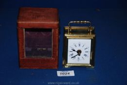 A Brass Carriage Clock in leather case, circa 1900, marked C. Maurel, Paris, 5'' high overall.