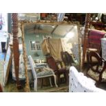 A large carved gilt-wood and gesso Over-mantel Mirror, the frame with leaf scrolls,