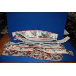 A quantity of curtain tie backs including floral and red, navy blue etc.