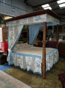 A Mahogany framed Four-poster Double Bed compete with back, mattress, canopy,