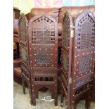 A heavy Eastern hardwood pierced worked and brass studded four-fold Screen,