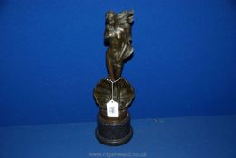 A bronze figure of a nude woman with long hair. 17 1/4" tall overall.