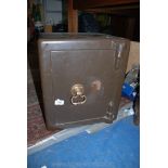 A small Safe with brass door handle, 17'' high x 15'' x 14''. ****COMPLETE with Key.