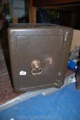 A small Safe with brass door handle, 17'' high x 15'' x 14''. ****COMPLETE with Key.