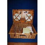 A Brexton wicker Picnic basket and contents, 21'' x 16''.
