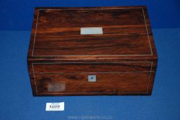A Mother of Pearl inlaid Rosewood Box, circa 1880, 10'' long x 7'' wide x 4 1/2'' deep.