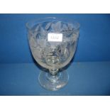 A large glass Goblet, the bowl being decorated with etched grapes and vine design,