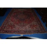 A contemporary Eastern bordered, patterned and fringed Rug,