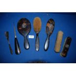 A quantity of Tortoiseshell monogrammed with 'W' including mirror, two brushes, shoe horn,