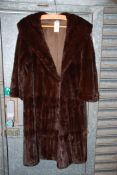 A vintage fur coat (mink??); 3/4 length sleeves, size 12/14, long length, initials 'DK' inside,