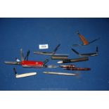 A quantity of miscellanea including a Swiss Army penknife and four others, fountain pens,