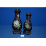 Two oriental lightweight Vases, with oriental design, and incorporating bases,