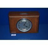 An Oak finished mantle Clock with movement marked Garrard,