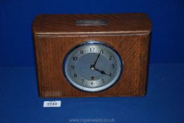 An Oak finished mantle Clock with movement marked Garrard,