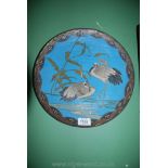 A Cloisonne Charger with nesting Herons design on blue ground and with spiral decoration to reverse,