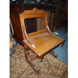 An Oak solid seated Side Chair of ecclesiastic flavour,