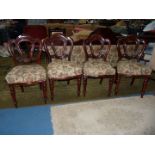 A set of four Mahogany/Satinwood framed Dining Chairs having turned front legs and crown-like backs