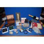 A quantity of miscellanea including wooden tea caddy (foot missing), a cased Bridge set, place mats,