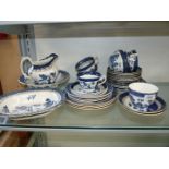 A quantity of mixed blue and white tea and dinnerware including Double Phoenix ironstone ware,