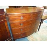 A bow fronted Mahogany circa 1900 Chest of three long and two short Drawers and having drop ring