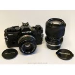 An Olympus OM-2 Spot/Program 35mm SLR Camera with Olympus Zuiko Auto-S 50mm f/1.